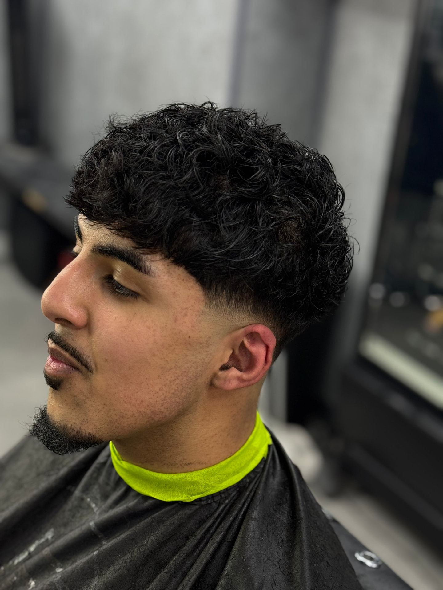 Curly top with low taper fade and beard shape